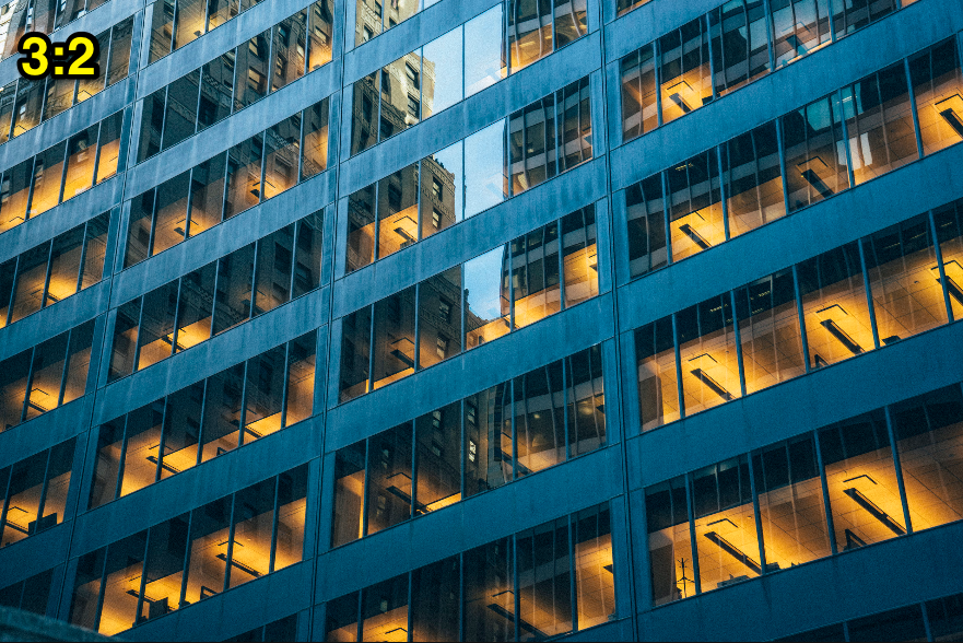 Corporate building lit up at night