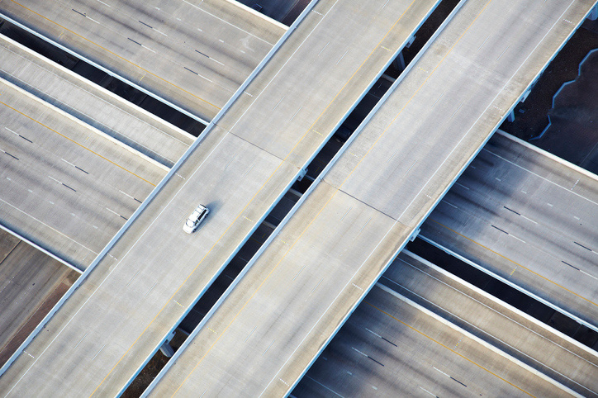 Aerial highway intersection at night